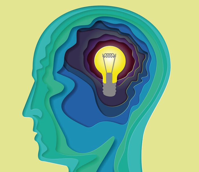 green sillhoette of human head with yellow light bulb in the middle - Science Shows Repeated Thoughts Are Powerful Tools to Improve Your Brain
